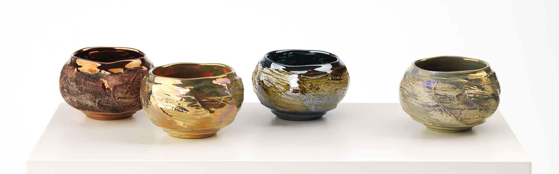Textured Faceted Bowls glazed with in glaze lustre inspired by frozen water